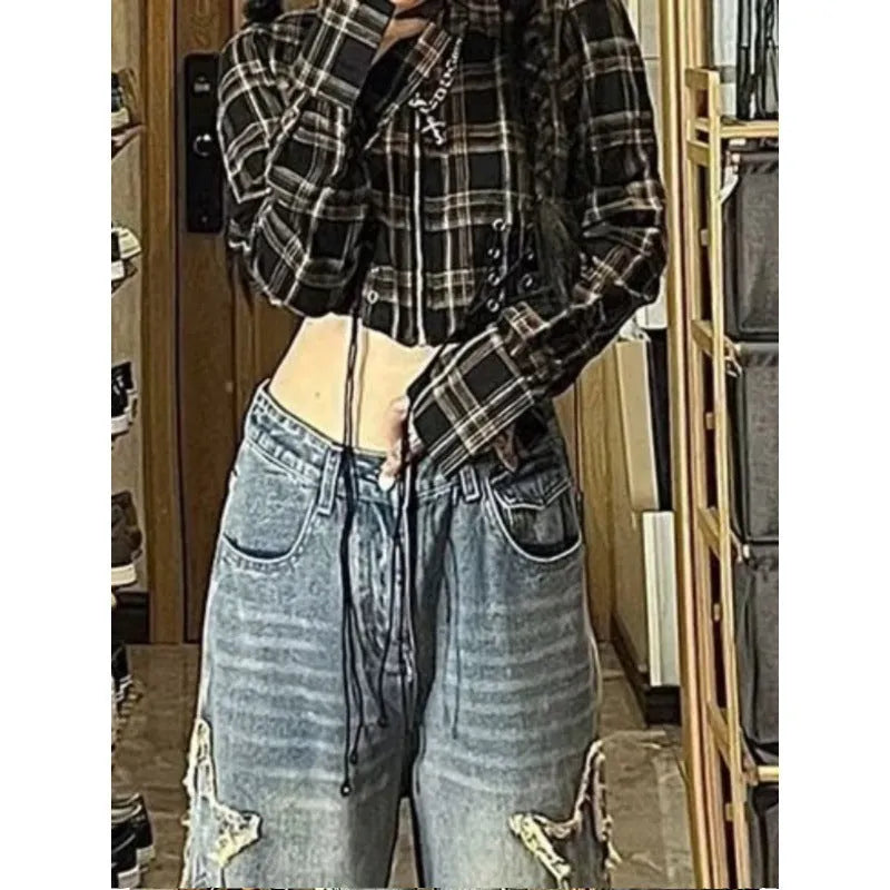 Blue high-waist women's jeans with a wide, straight leg, laid flat.