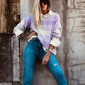 Lilac plaid print loose sweater with ribbed trim and long sleeves on hanger