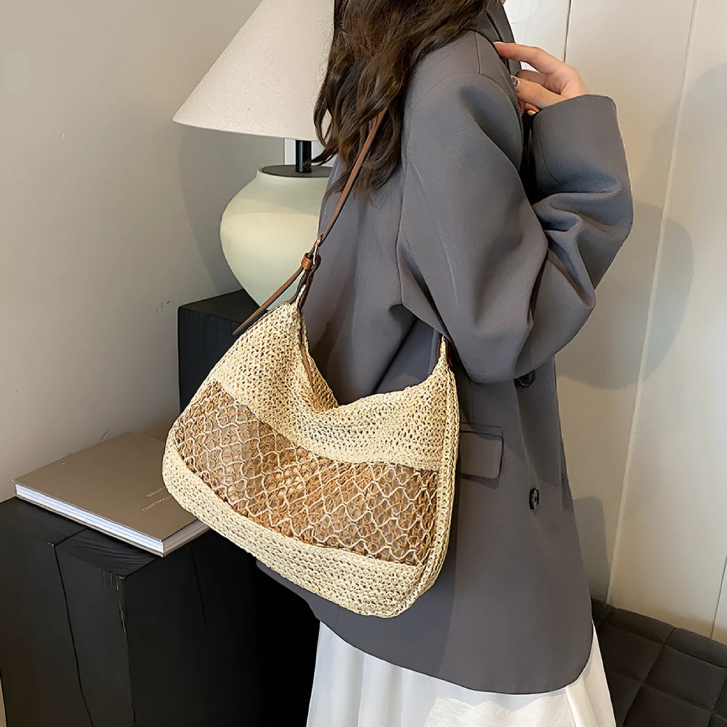 Women's straw cross body bag in khaki colour showing horizontal square shape and woven texture
