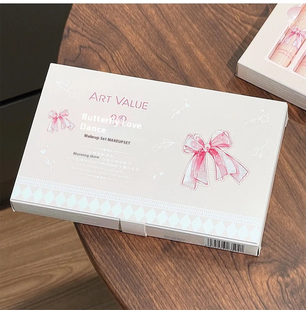 Butterfly Box makeup set containing four pink matte lip muds, one powder blusher, and a butterfly necklace in standard packaging.