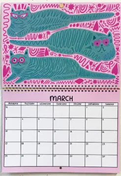 A cat-themed paper wall calendar for 2024 or 2025 displayed flat.