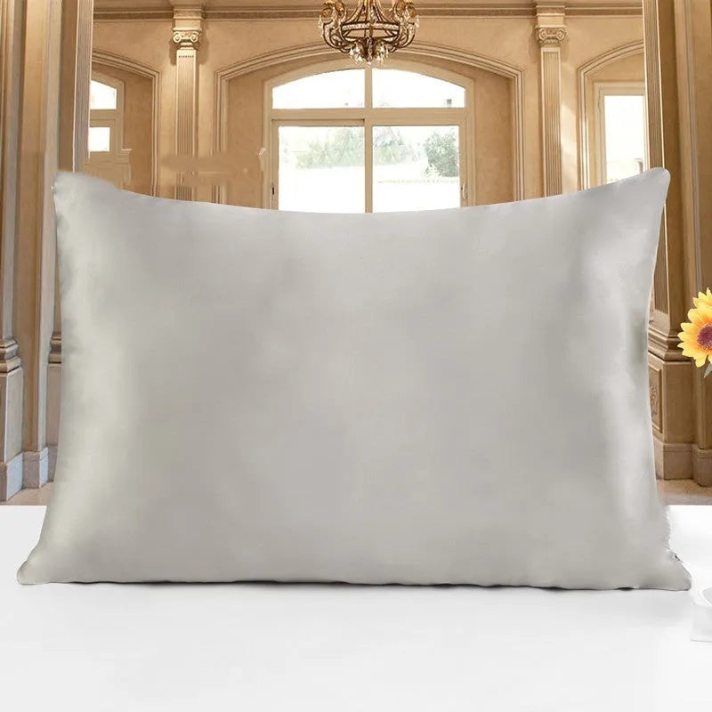19 M double-sided silk pillowcase shown in apricot colour, lying flat to show envelope closure.