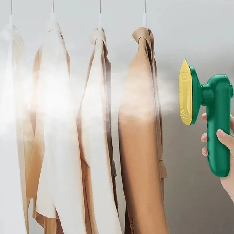 Dark green hand-held steam iron with ceramic panel showing dual temperature buttons and compact design