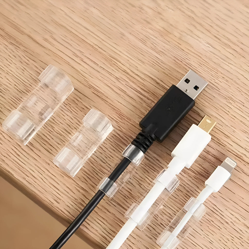 Transparent self-adhesive plastic cable clips in four different sizes for wire management.