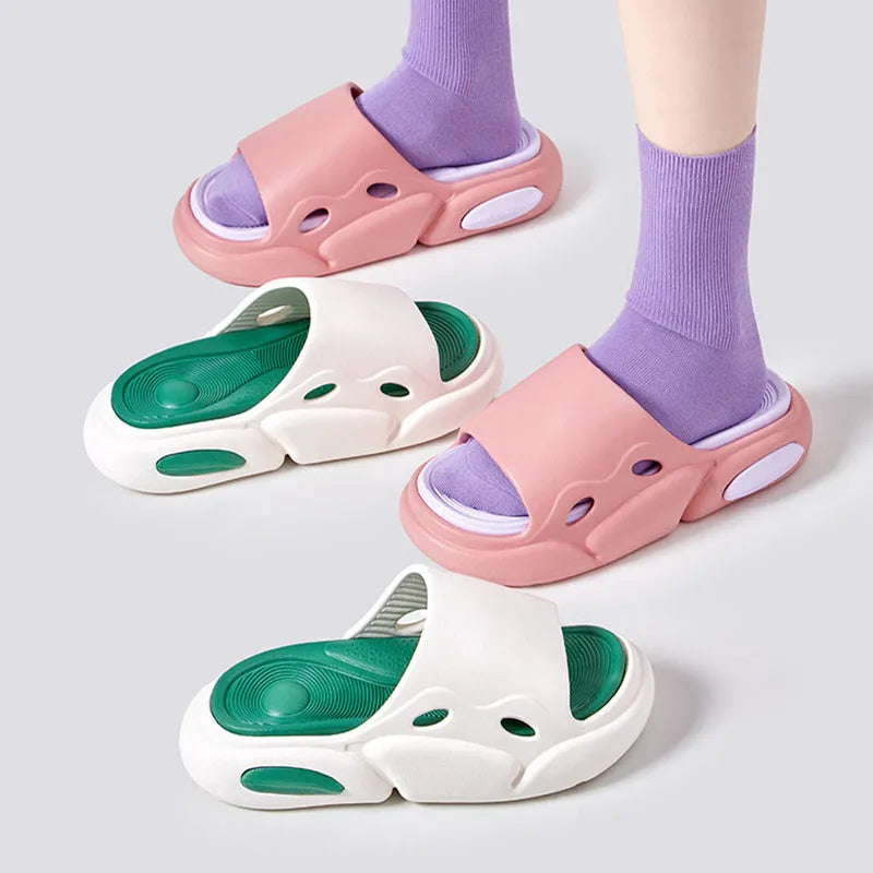 Women's two-colour EVA foam slippers with thick sole in pink and purple, shown on a foot.