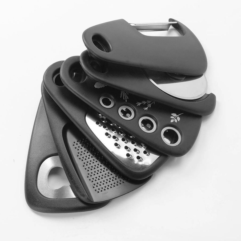 Six stackable kitchen gadgets including peelers, a brush, and tongs in a colour box.
