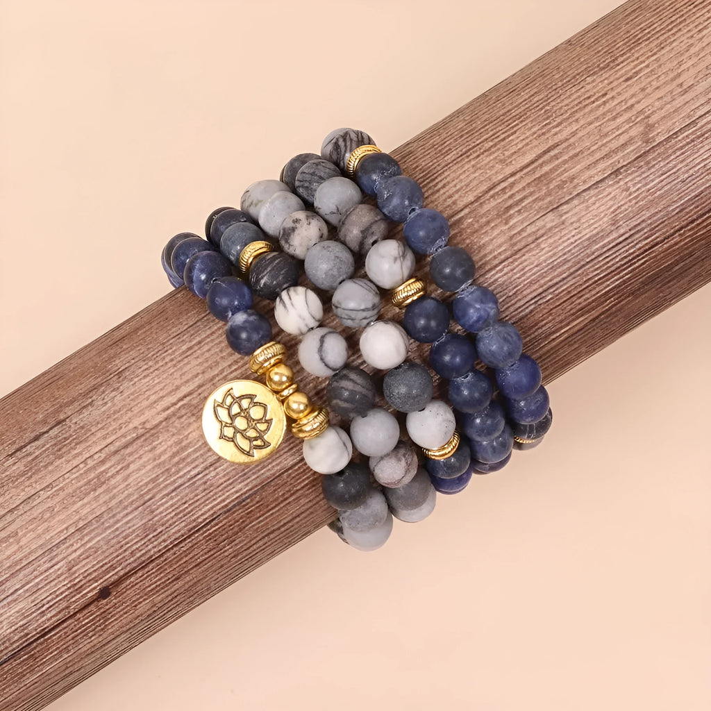 Blue patterned network stone beads on a multi-layer bracelet with an alloy clasp.