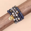 Blue patterned network stone beads on a multi-layer bracelet with an alloy clasp.