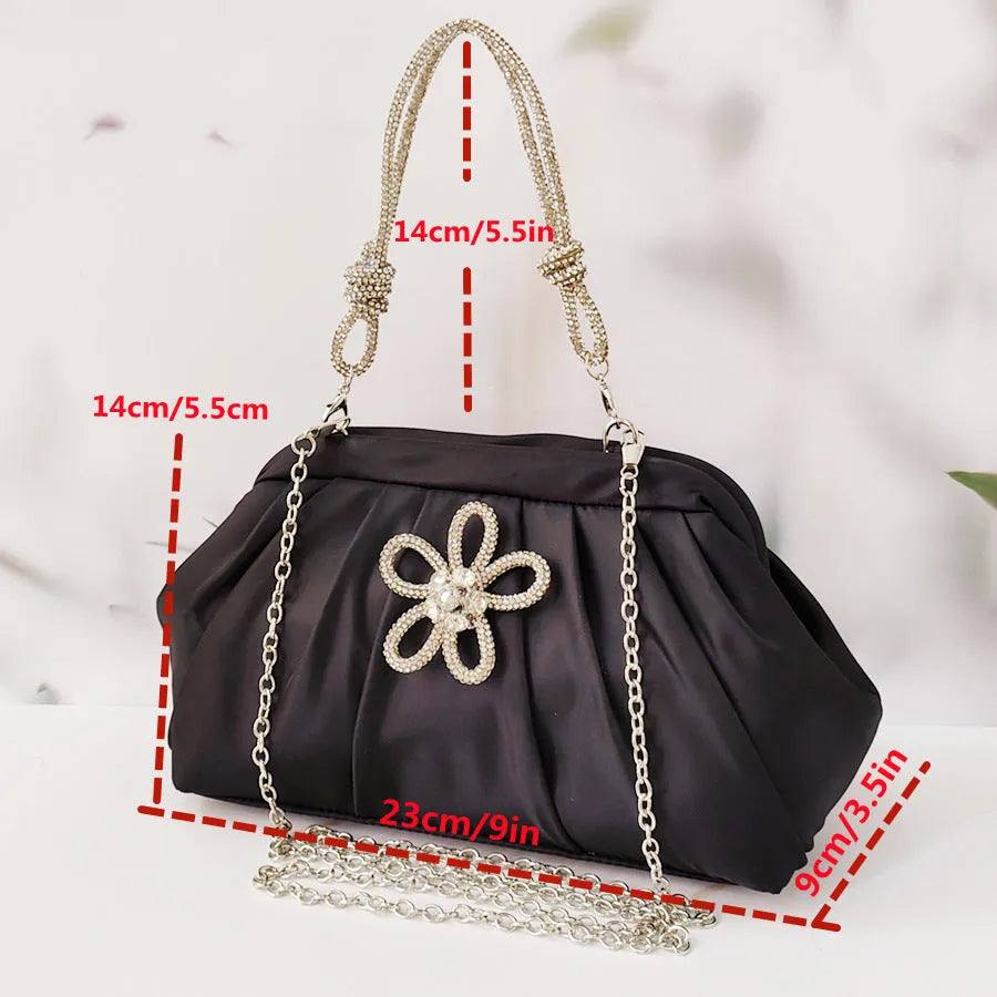 Women's soft polyester messenger bag with chain detailing and diamond pattern in black colour