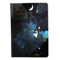 A5 notebook with luminous holographic cover lying flat, showing colourful illustrated interior pages.