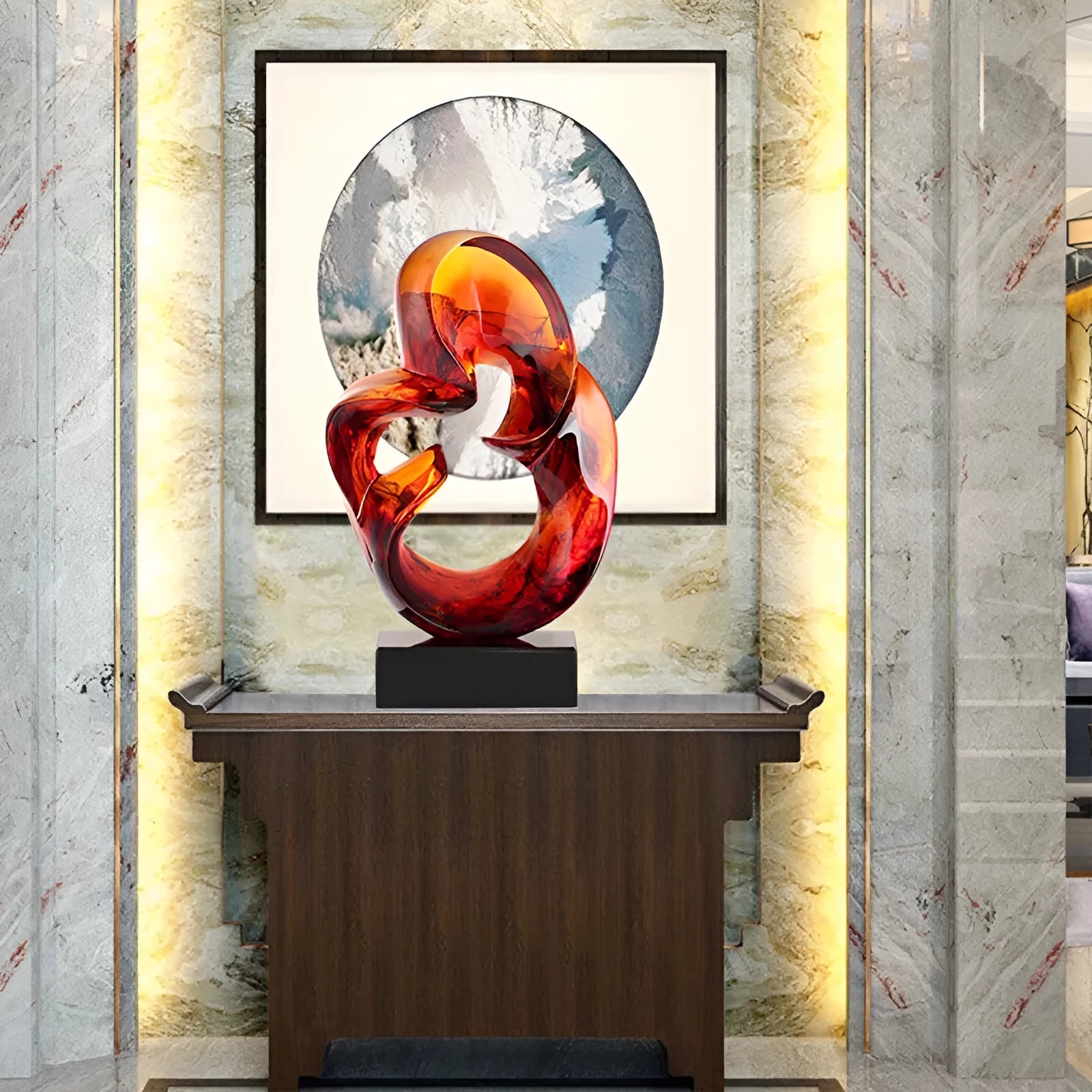 Clear transparent resin sculpture ornament in modern style on a shelf, shown in blue and orange red colour options.