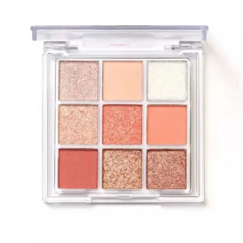 Nine colour eyeshadow palette in plastic case with sunset coral, red brown, cocoa and chocolate brown shades