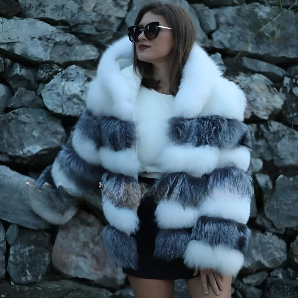 Women's artificial fur hooded coat in street fashion style showing brown and white silver fox colour options