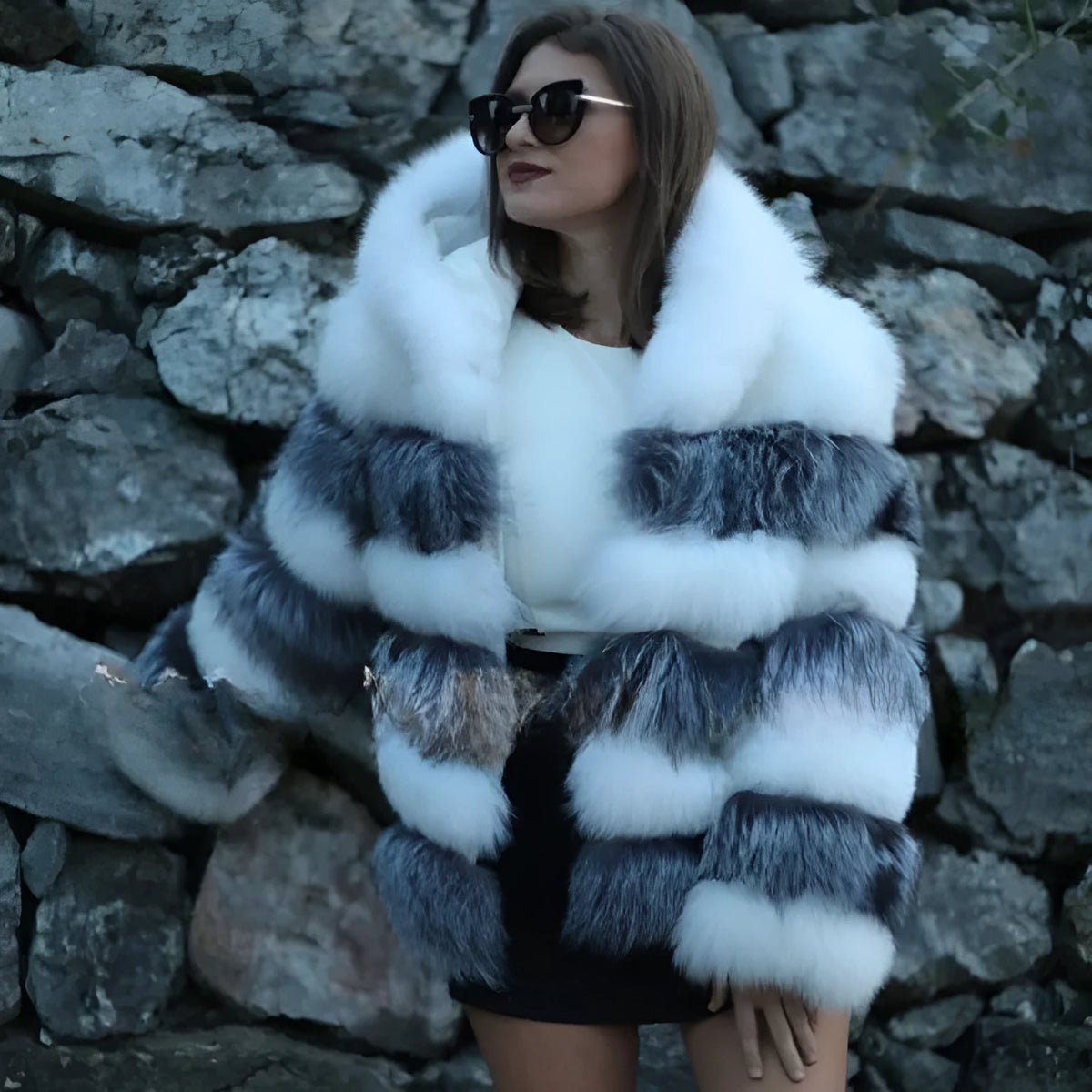 Women's artificial fur hooded coat in street fashion style showing brown and white silver fox colour options