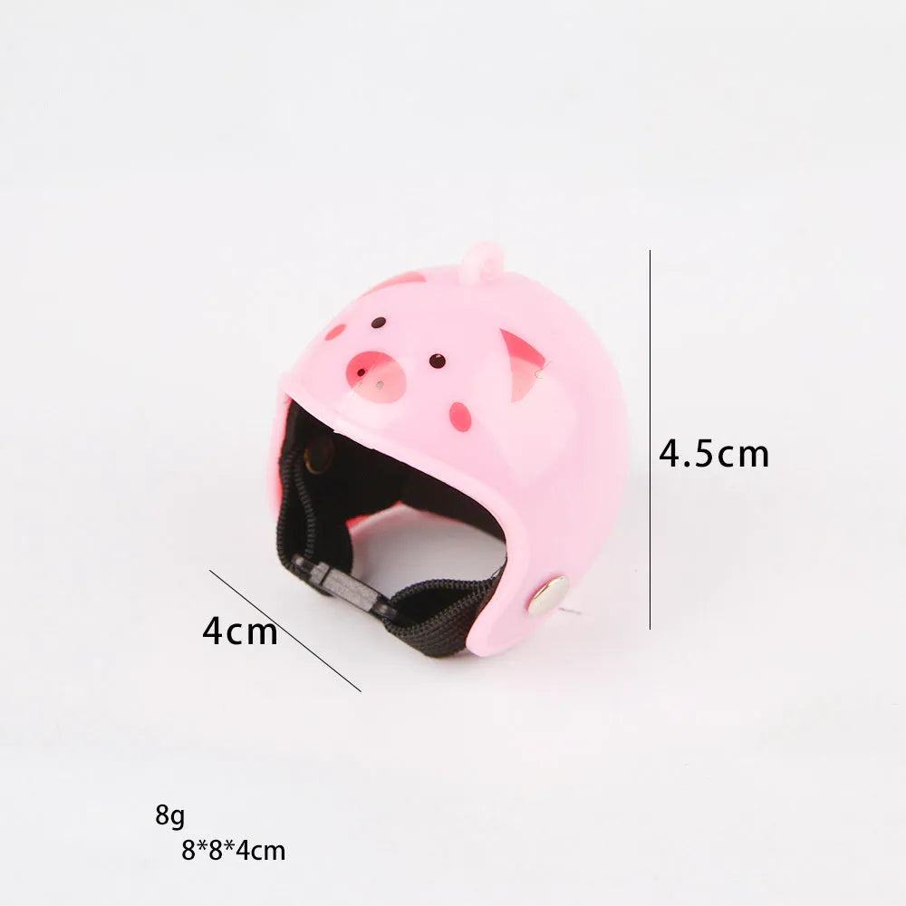 Small colourful plastic helmet with elastic straps, designed for a chicken or small bird to wear.