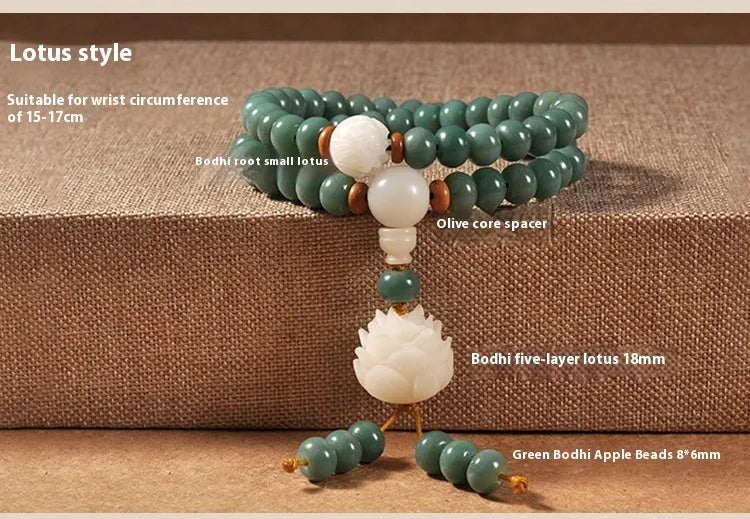 White and green beaded bracelet with a double ring safety buckle and a prominent double ring lotus bead decoration.