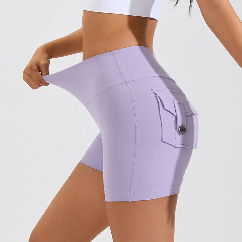 Women's high waist sport shorts in avocado green, side view showing pocket detail.