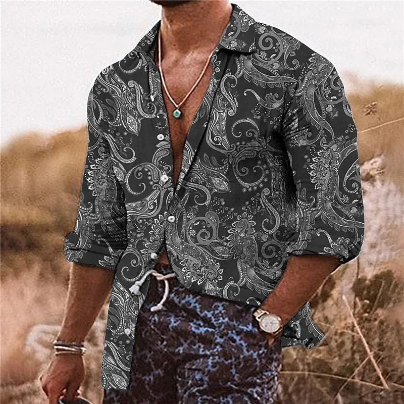 Man wearing a loose-fit bohemian-style shirt with a vibrant 3D floral print and long sleeves.
