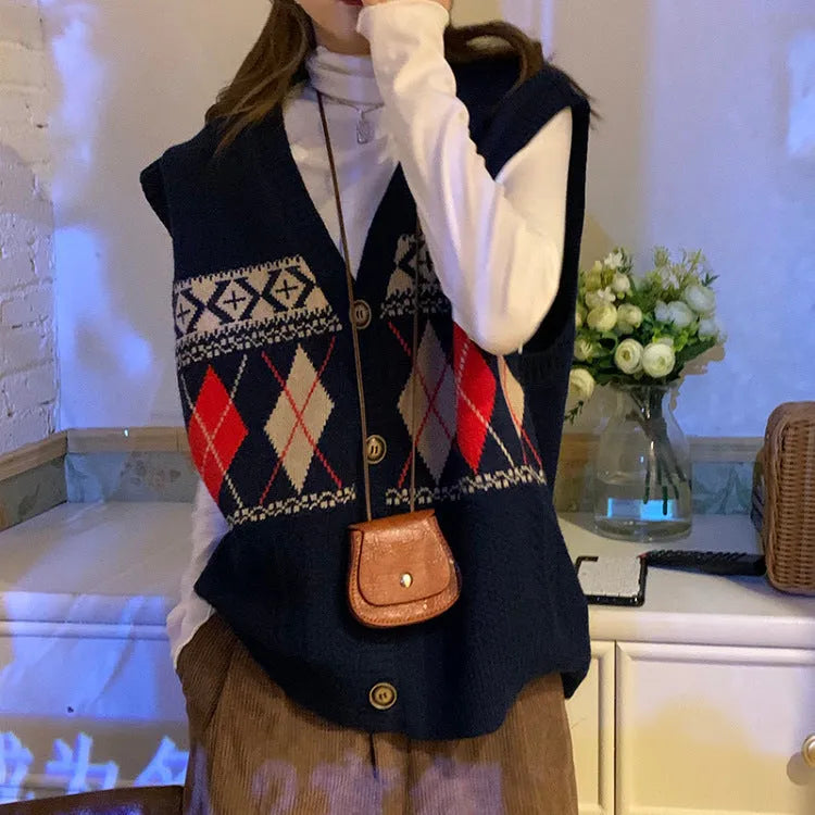 Loose sleeveless cardigan top in diamond plaid acrylic knit showing khaki navy blue and red colour options