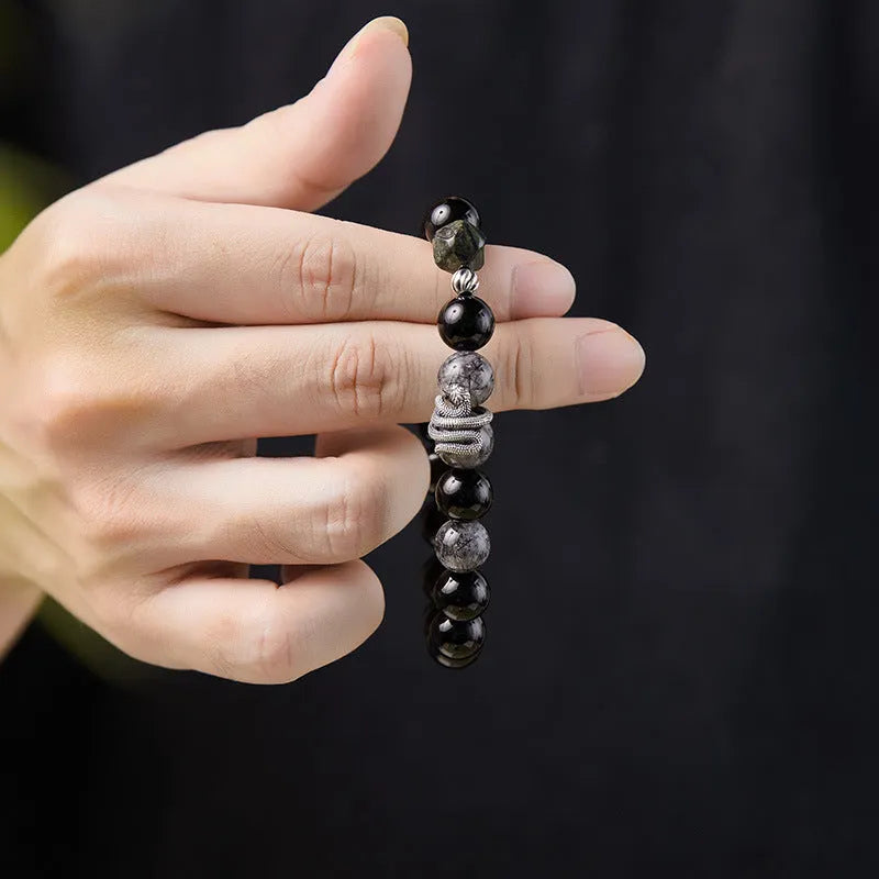 Men's black snake bracelet in sterling silver with obsidian detailing showing 10mm diameter