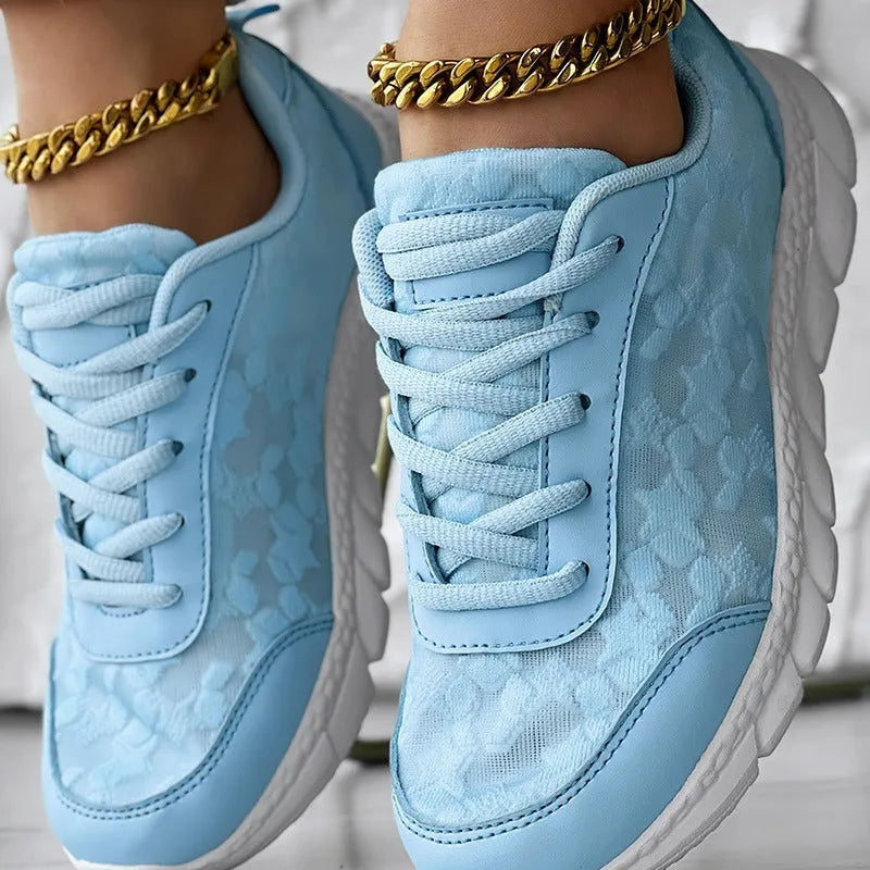Women's casual canvas running shoes in white, shown from the side on a plain background.