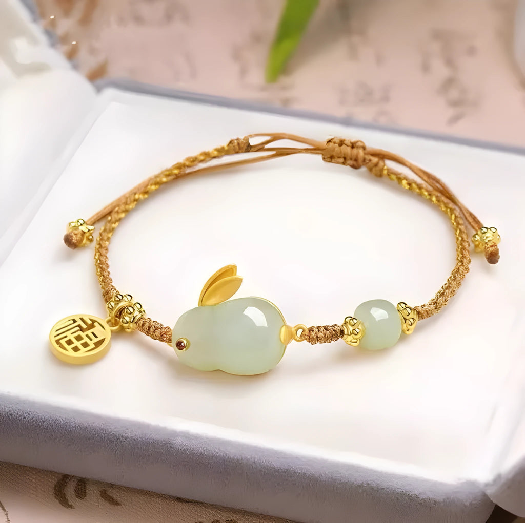 Yellow string bracelet with a geometric Hetian jade charm shaped like a rabbit for women.