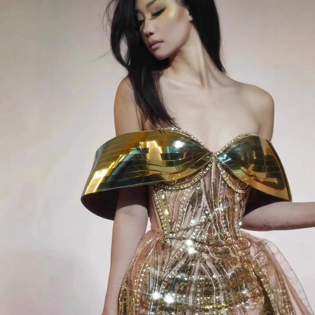 Gold strapless sequin evening dress with thigh-high split and floor-length silhouette