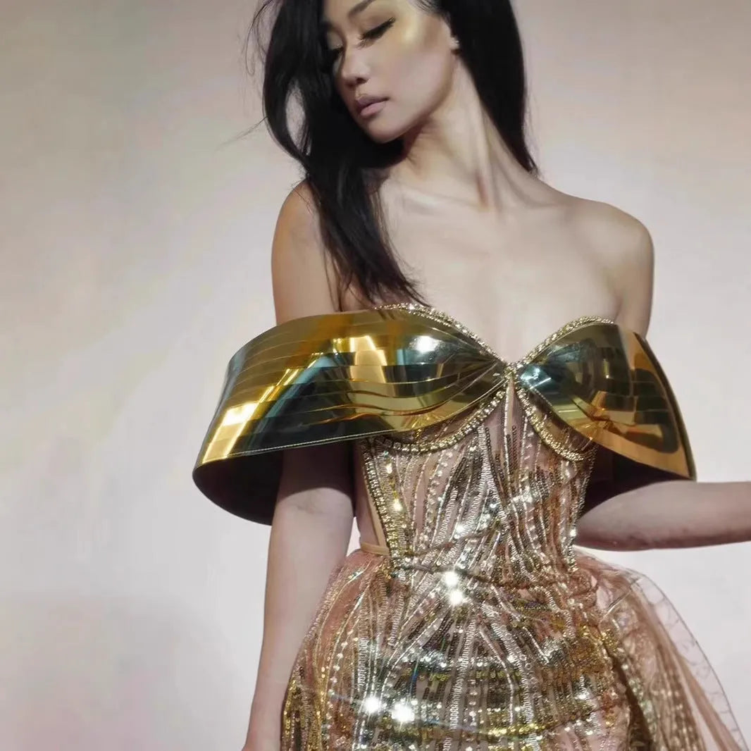 Gold strapless sequin evening dress with thigh-high split and floor-length silhouette