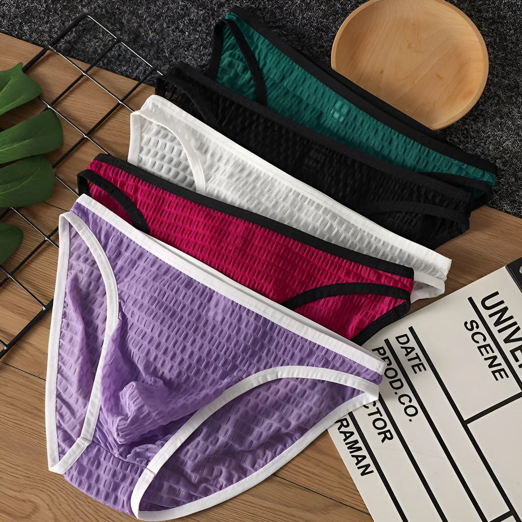 Men's low waist transparent lace underwear in black on a white background