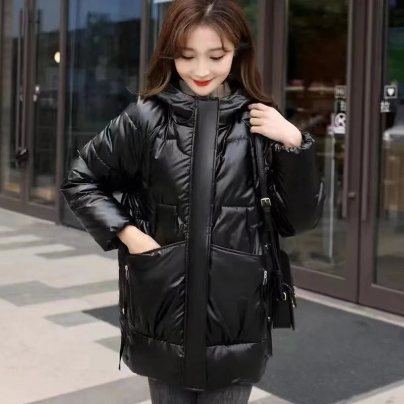 Women's loose thick hooded winter jacket in blue, showing front view with long sleeves.