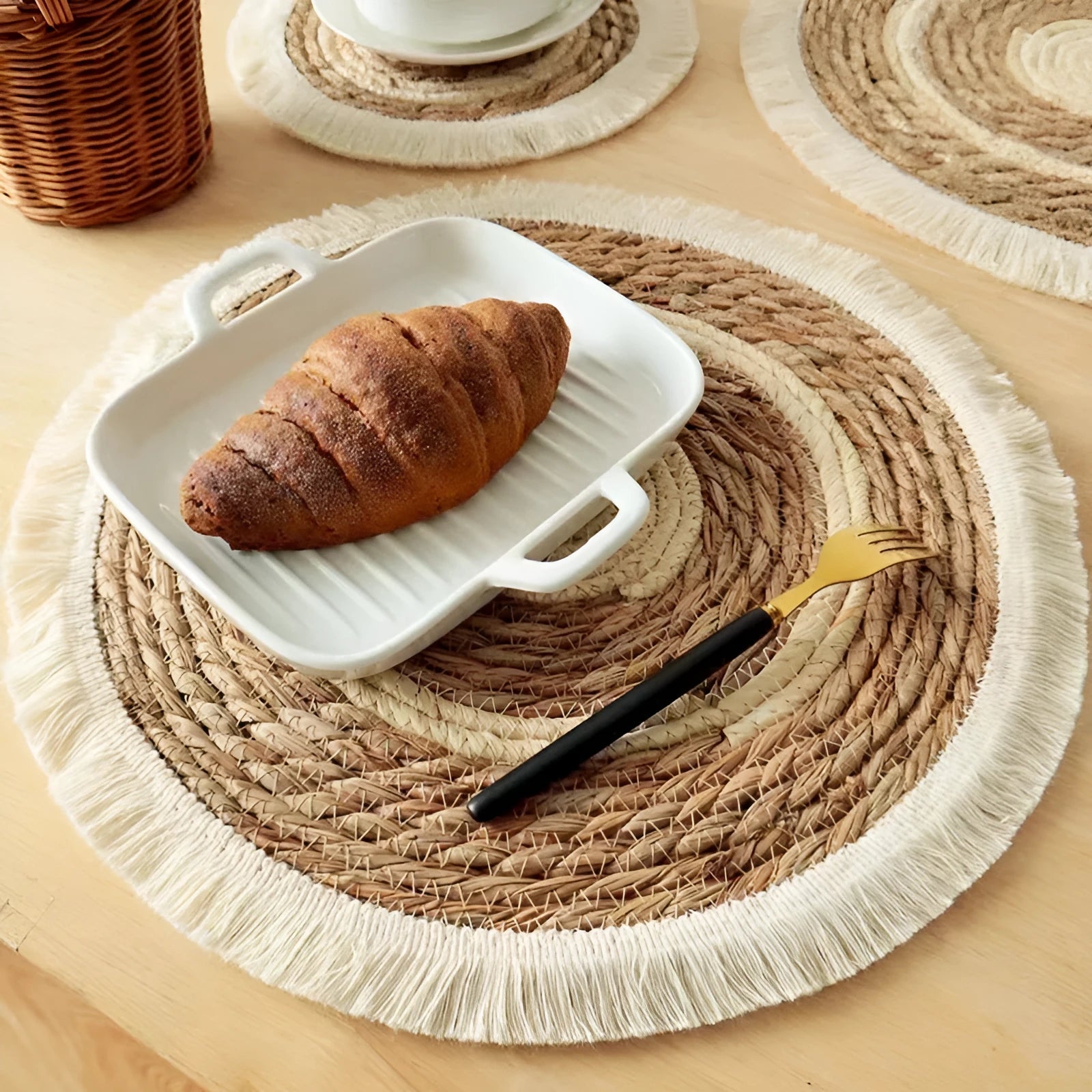 Round papyrus placemat with corn rope tassel edge in solid natural colour, available in multiple sizes.