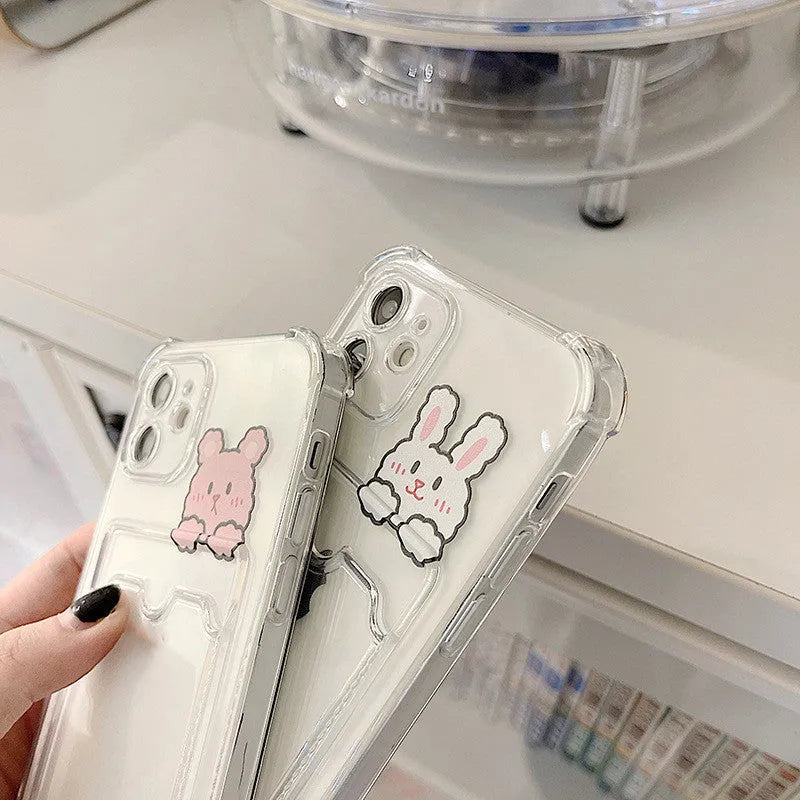 Transparent TPU phone case with cartoon paint design and card holder slot fitted on Apple iPhone