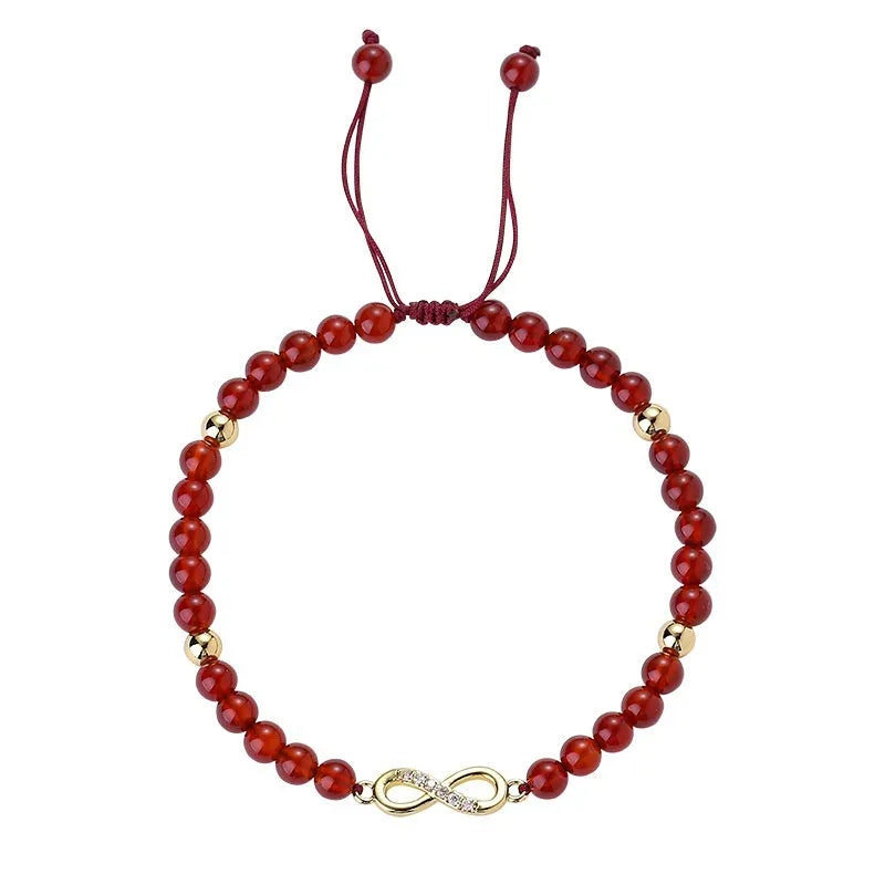 Hand-woven ethnic bracelet with natural red agate beads in diamond shapes showing woven pattern detail
