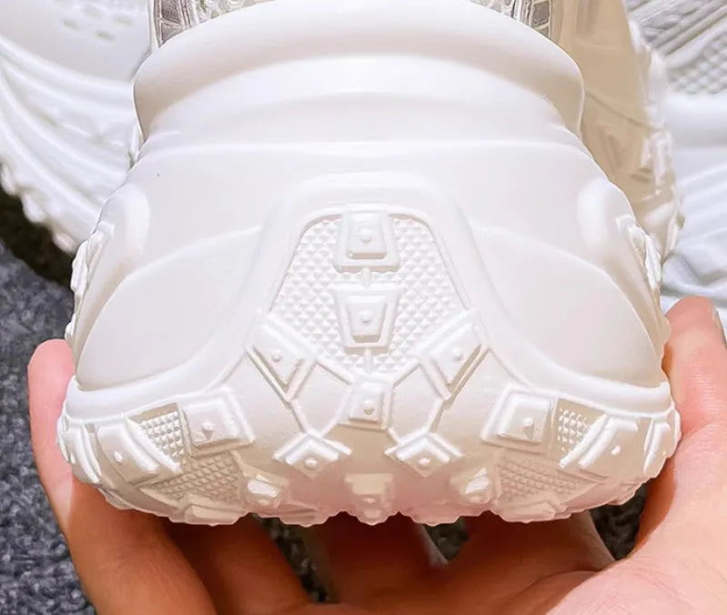 White women's height increasing dad shoes with lace-up front and round toe.