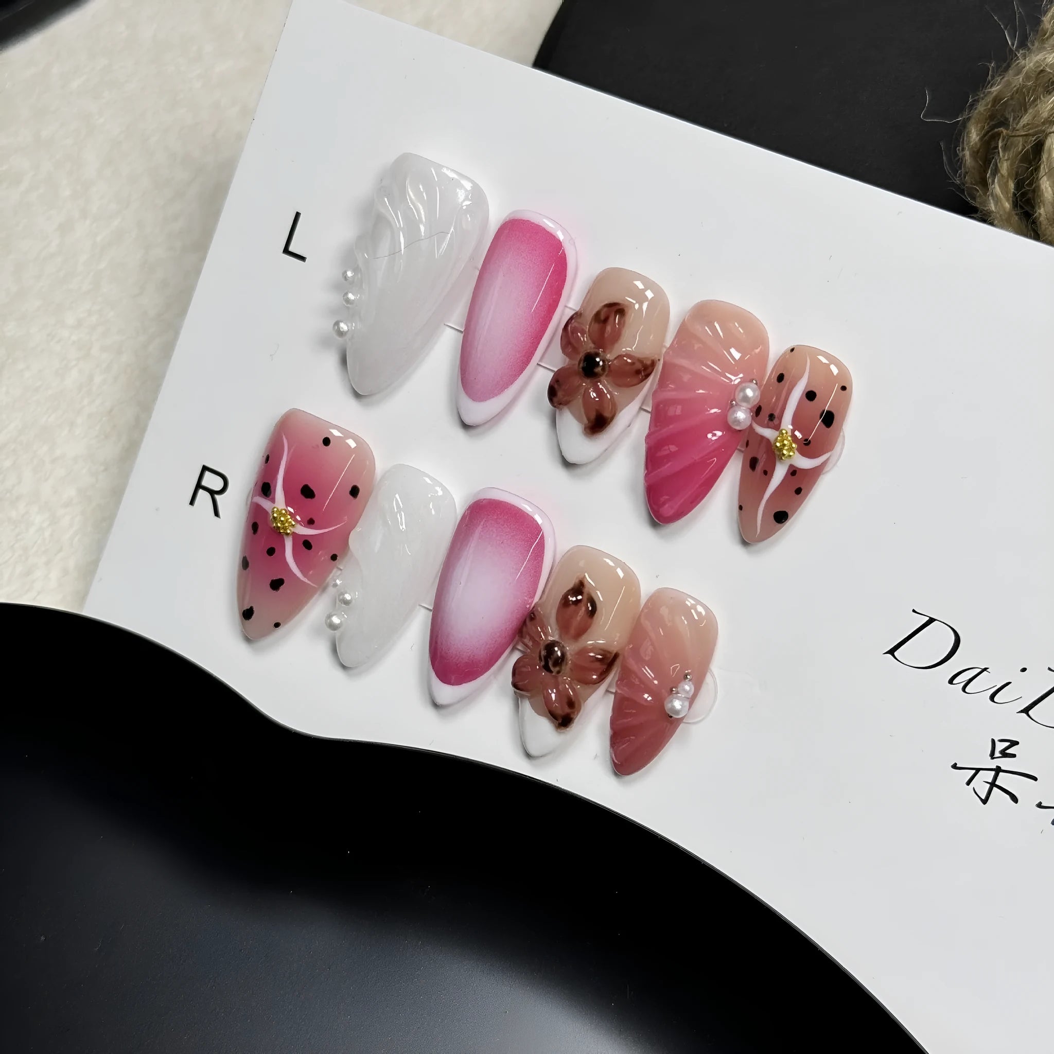 Hand-painted three-dimensional nail art patches with embossed candy patterns in almond shapes