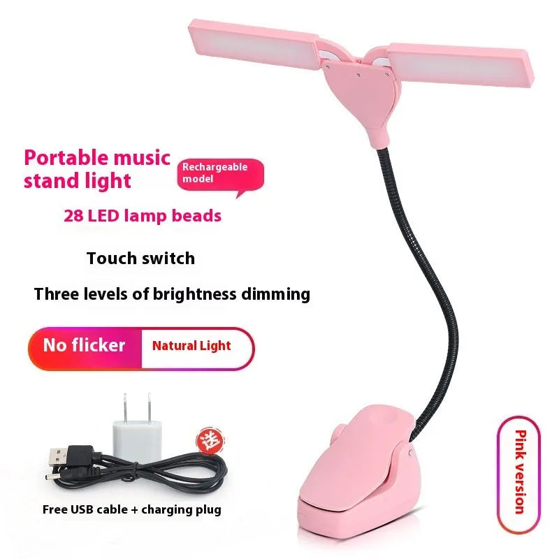 Black rechargeable LED music stand lamp with clip, shown illuminating sheet music.
