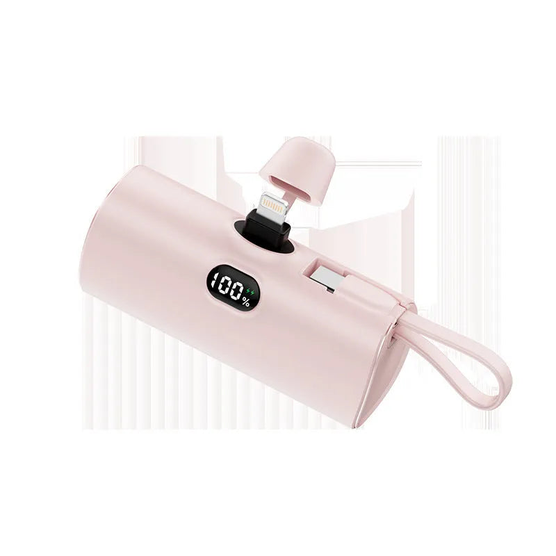 Capsule shaped wireless power bank with digital display showing battery percentage