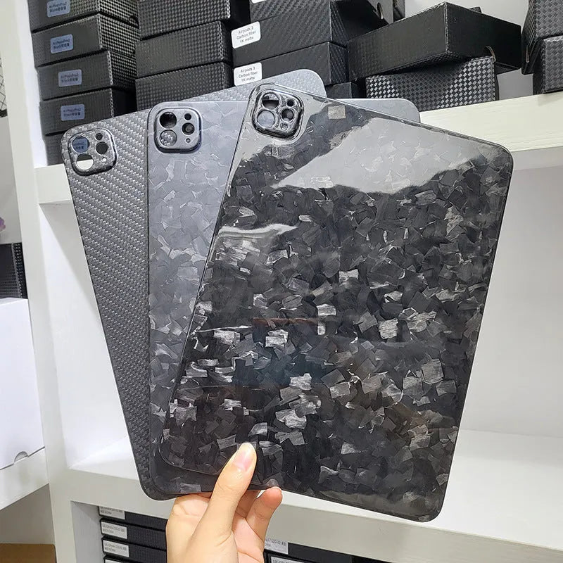 Carbon fibre hard case for Apple iPad Pro 11 showing embossed plaid pattern and matte finish.