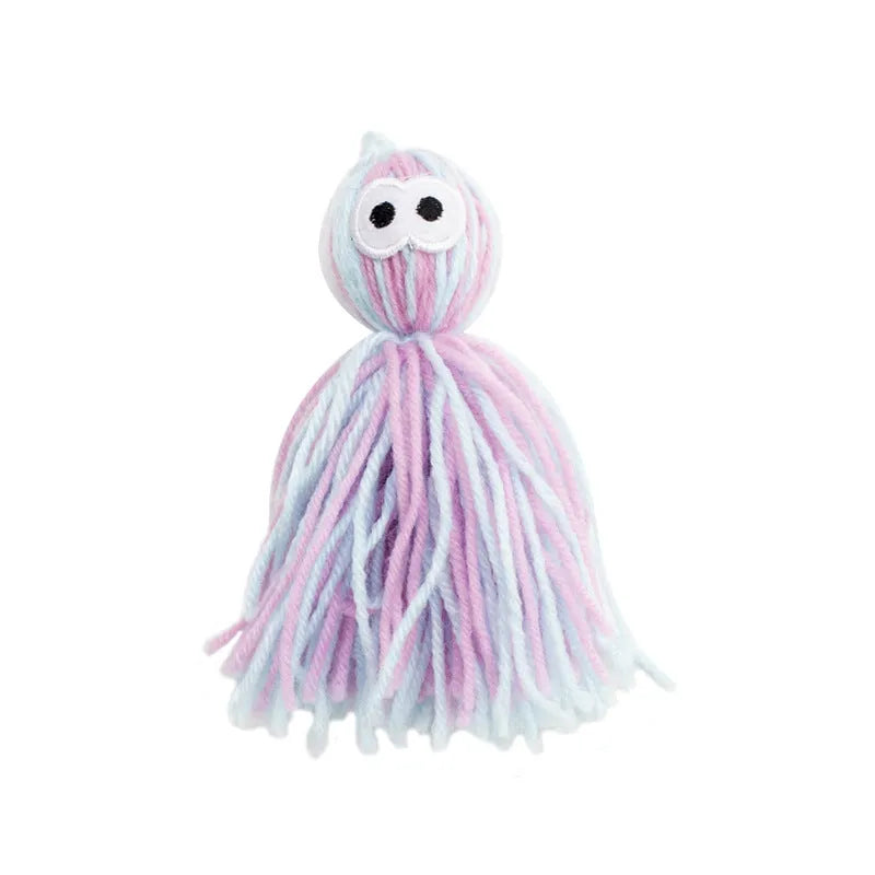 Hanging wool ball cat toy with teaser stick in pink and blue colours on a white background.