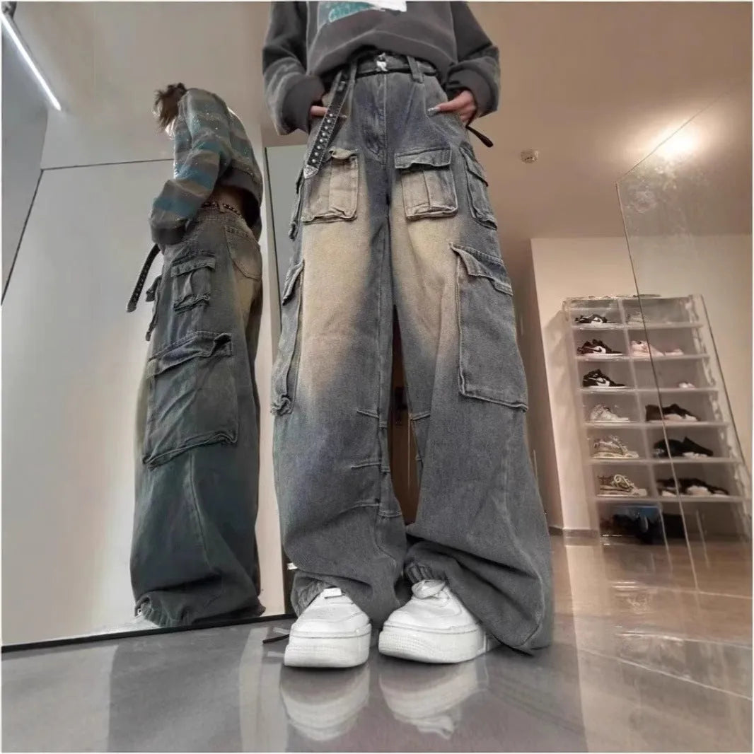 Light blue distressed denim pants with multiple pockets and straight leg loose fit