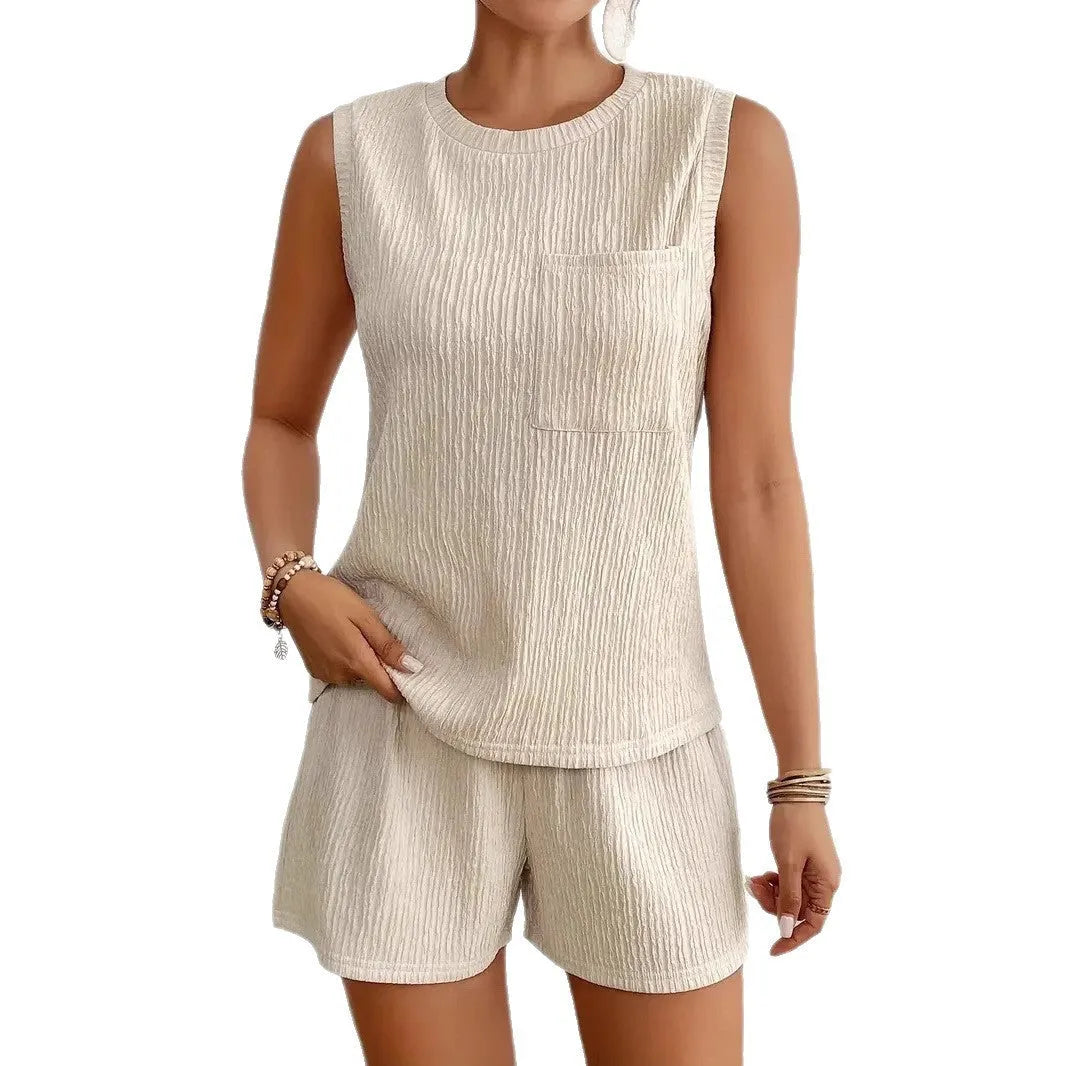 Apricot sleeveless round neck vest and matching shorts laid flat.