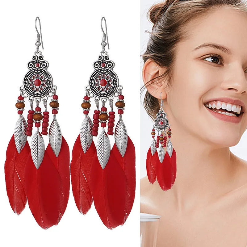 Retro feather drop earrings with leaf pattern in alloy material available in multiple colours