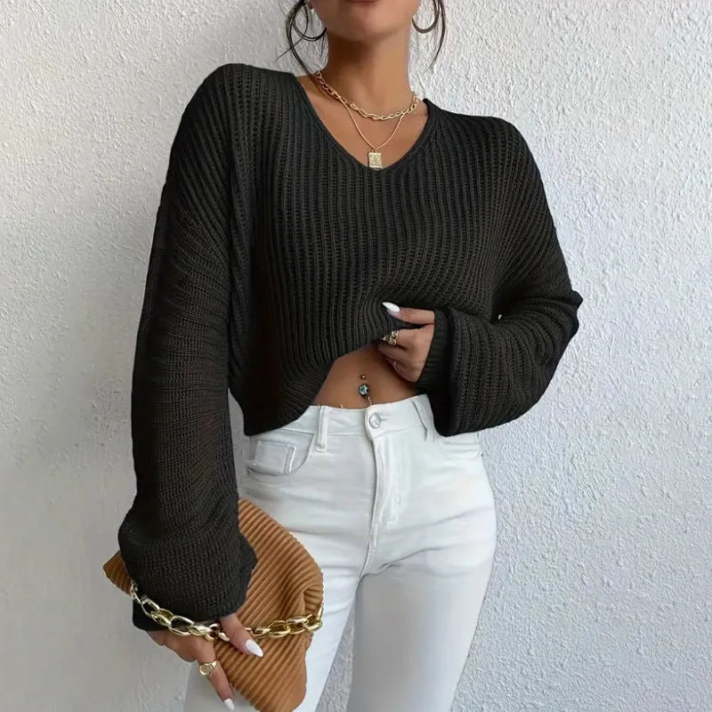 Women's solid color long sleeve pullover top in loose casual fit made of polyester