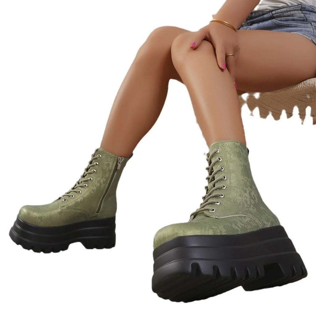 Women's white retro platform Martin boots with patchwork design and side zip.
