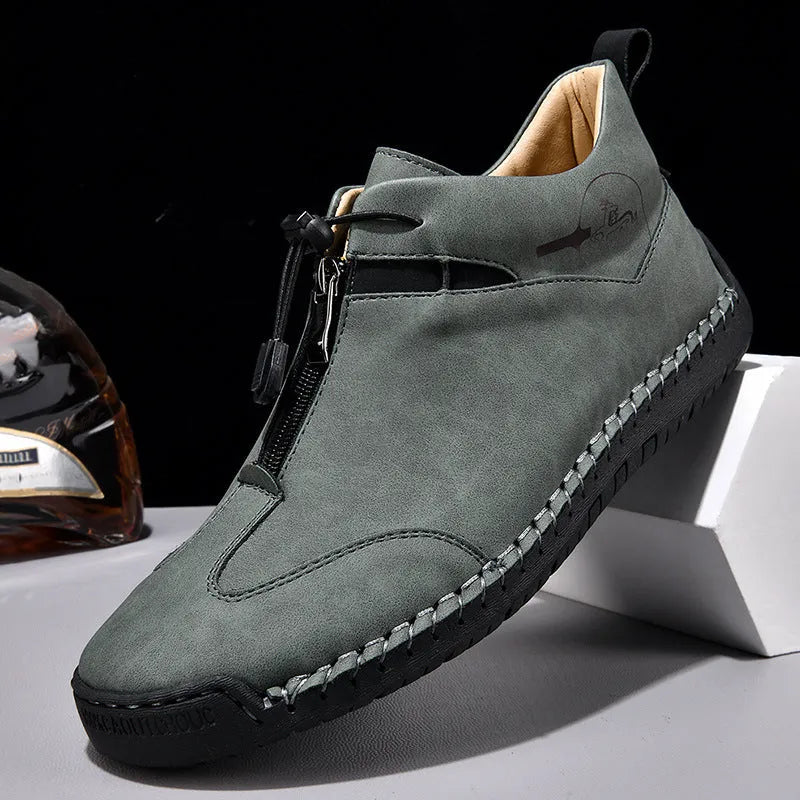 Men's casual leather shoes in black with a mid heel, rounded toe, and reinforced leather upper.
