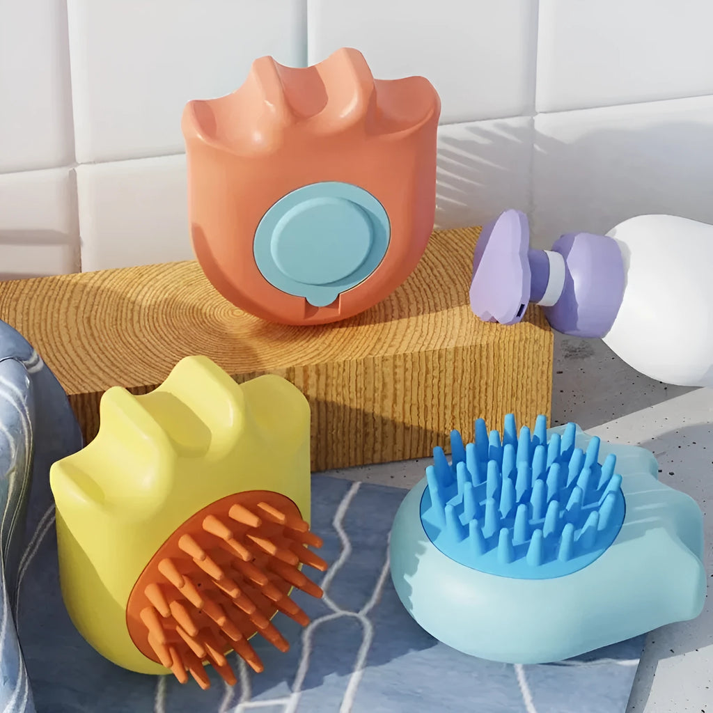 Blue pet bath brush with integrated shampoo box for washing cats and dogs.