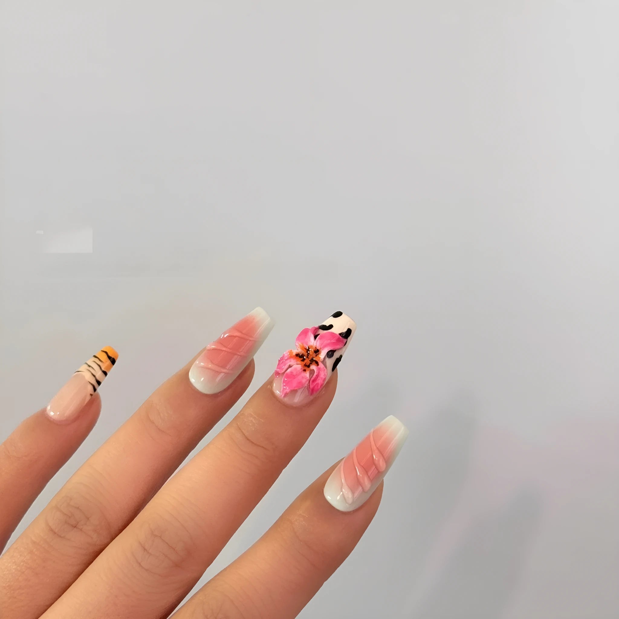 Zebra pattern Lily hand carving nail art with embossed flower designs in four sizes