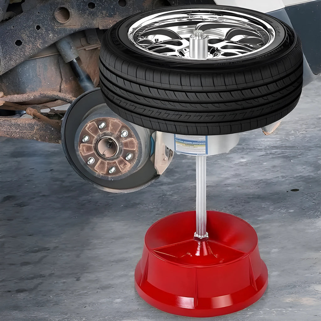 Portable aluminium hub balancer for car and truck tyres with 1.5 to 4 inch hub range on enamel-finished base.
