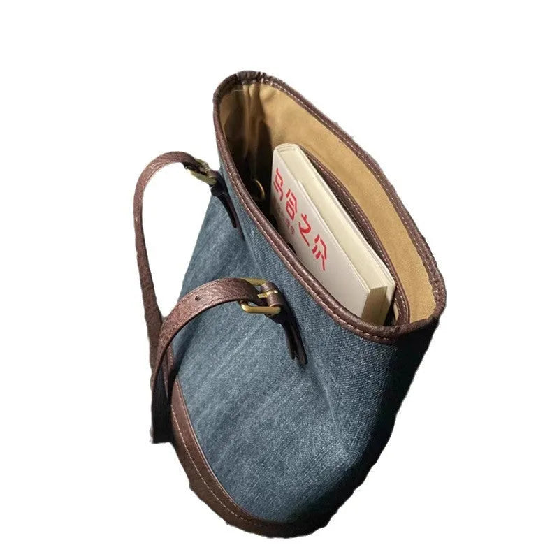 Retro denim patchwork one-shoulder bucket handbag showing large capacity interior