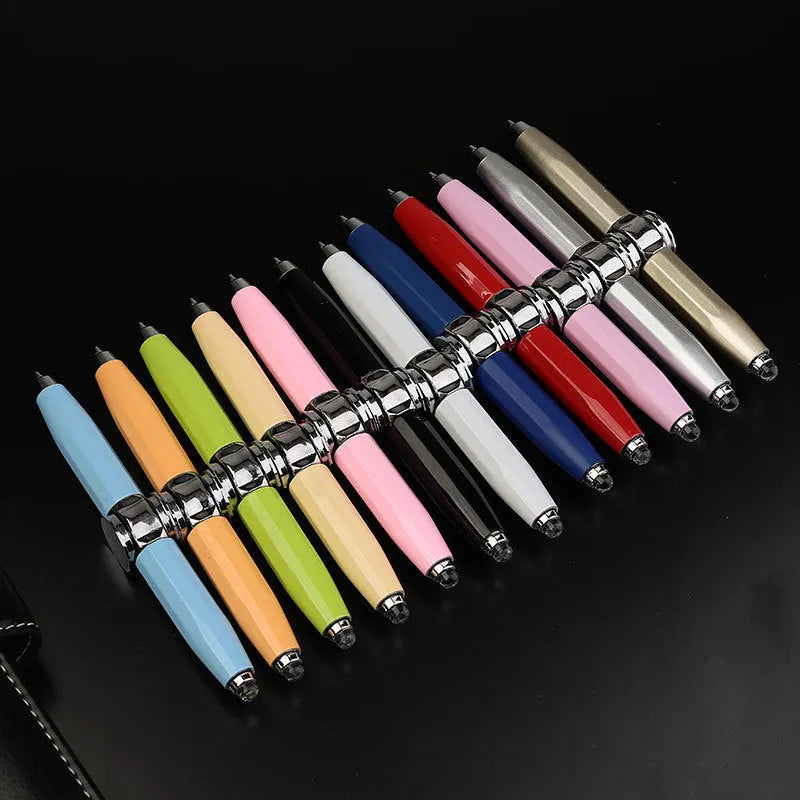 Metal LED pen spinner ballpoint pen showing spinner mechanism and writing tip with multiple ink colour options